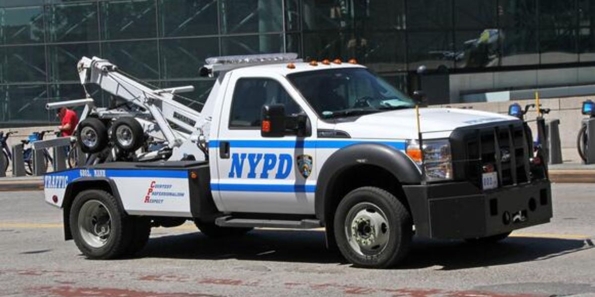 Controversy Unfolds Luxury Cars of Migrants Seized Outside NYC Shelter Amid Begging Debate